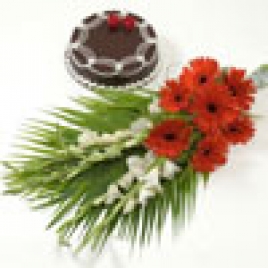 Bunch Of Red Gerberas With Tuberose And Fresh Chocolate Cake